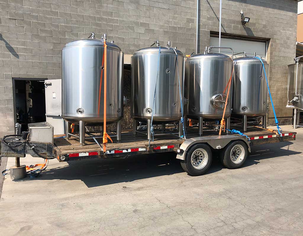 Biron Construction four smaller tanks on trailer for delivery