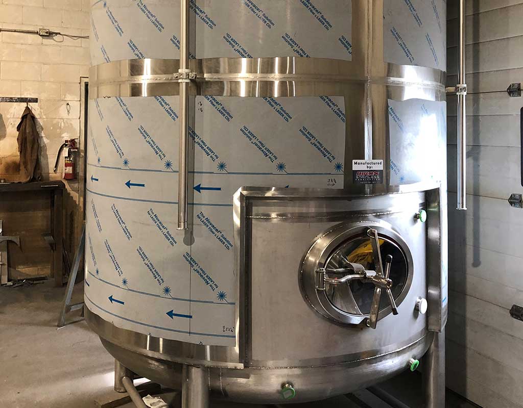 Biron Construction protective film on tank during installation